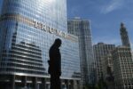 Captivating view of Chicago skyline with Trump Tower reflections and a silhouette in daylight.